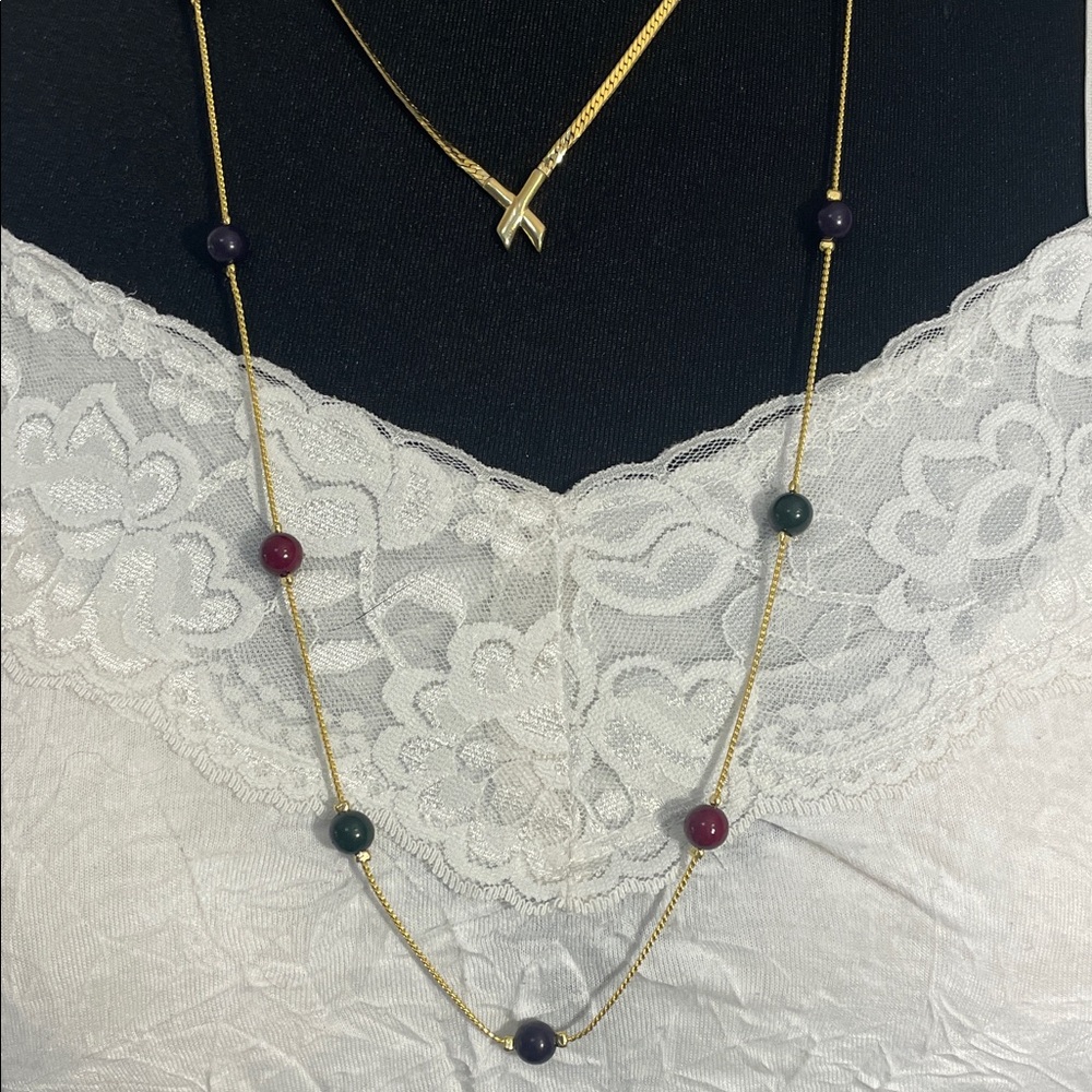 Gold Layered necklace set featuring a long beaded necklace and a shorter one
